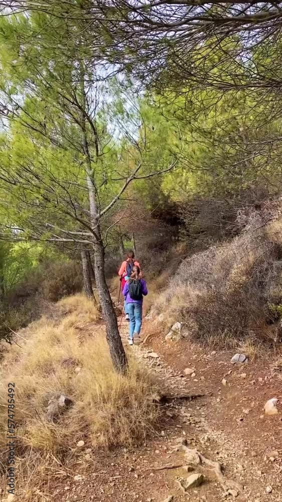 Kids hiking in the forest, path to peak Mijas, Malaga, Spain Kids hiking in the forest, path to peak Mijas, Malaga, Spain