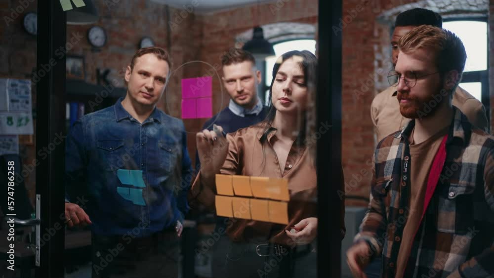 Woman Head Of Marketing Department Presenting New Idea To Multiethnic Team Of Employees Woman Head Of Marketing Department Presenting New Idea To Multiethnic Team Of Employees