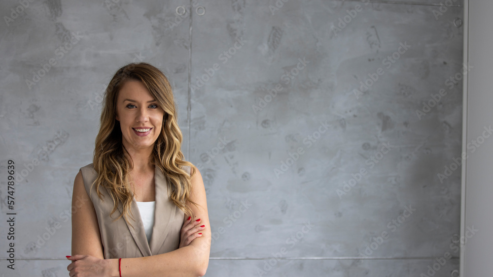 Shot of a confident young businesswoman standing in a modern office Shot of a confident young businesswoman standing in a modern office