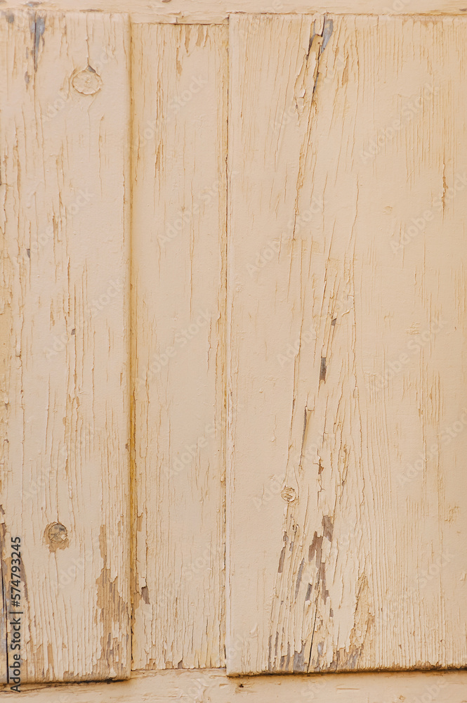 Background, texture of a wooden painted door with peeling paint from cracks. Photo close-up, copy space. Background, texture of a wooden painted door with peeling paint from cracks. Photo close-up, copy space.
