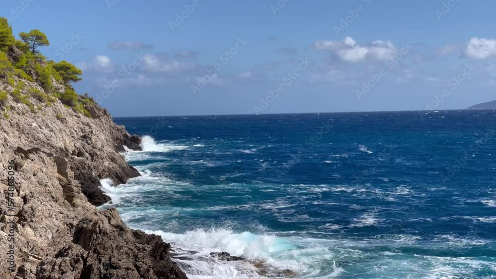 Cephalonia Greek island rocky shore slow motion Ionic sea waves landscape 4K footage. Beauty in nature and traveling concept. Cephalonia Greek island rocky shore slow motion Ionic sea waves landscape 4K footage. Beauty in nature and traveling concept.
