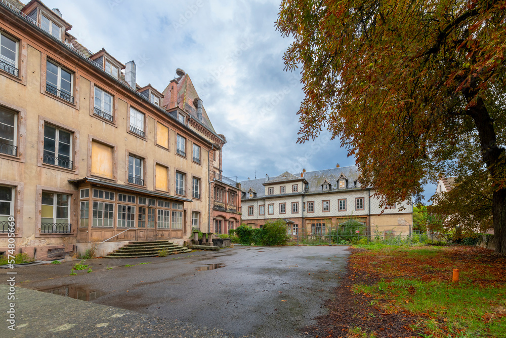 Abandoned turn of the century buildings near the historic abbey ruins at Place Marche in the Alsatian town of Munster, France.