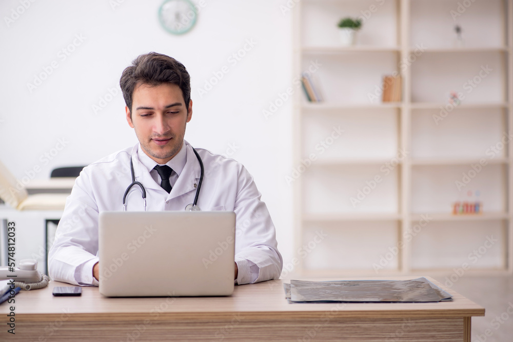 Young male doctor in telemedicine concept Young male doctor in telemedicine concept