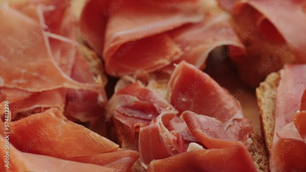 Jamon iberico tapas close up, chef cooking the best spanish ham pork tapas, cafe with traditional food. Jamon iberico tapas close up, chef cooking the best spanish ham pork tapas, cafe with traditional food.