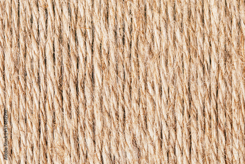 Rope texture. Brown old rope lines. Striped pattern. Retro textile texture. Stripes background on canvas. Twine pattern.