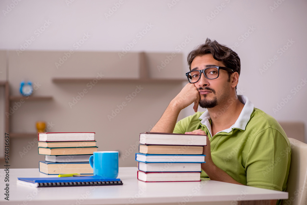 Young male student studying at home Young male student studying at home