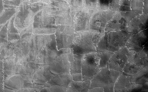 Gray or black concrete background with rough texture and dirt.