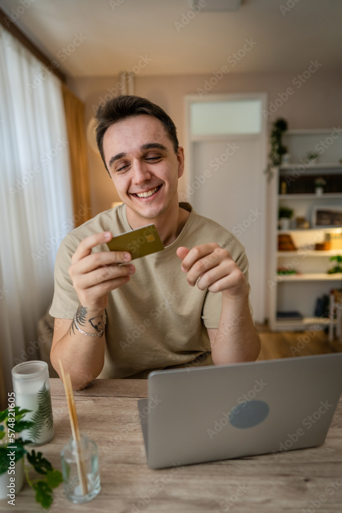 happy man online shopping use credit card laptop computer at home happy man online shopping use credit card laptop computer at home