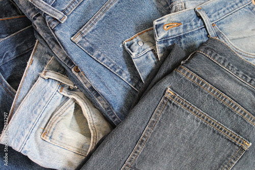 A variety of color and style of jeans