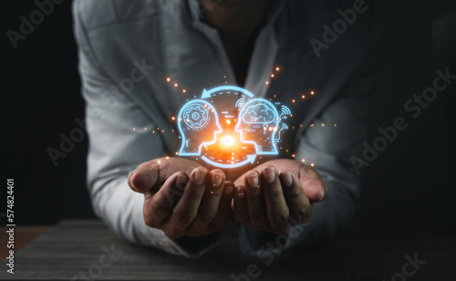 Foto Close up of businessman hand holding brain in palm, Virtual reality man with symbol neurons in the brain