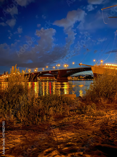 Scenic view River Rhine, Theodor Heuss bridge and the city of Mainz, Germany at night photo