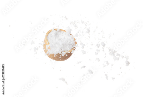 Refined Salt fall down pouring in wooden bowl, powder white salts explode abstract cloud fly. Small ground salt splash in air, food object element design. White background isolated high speed freeze photo