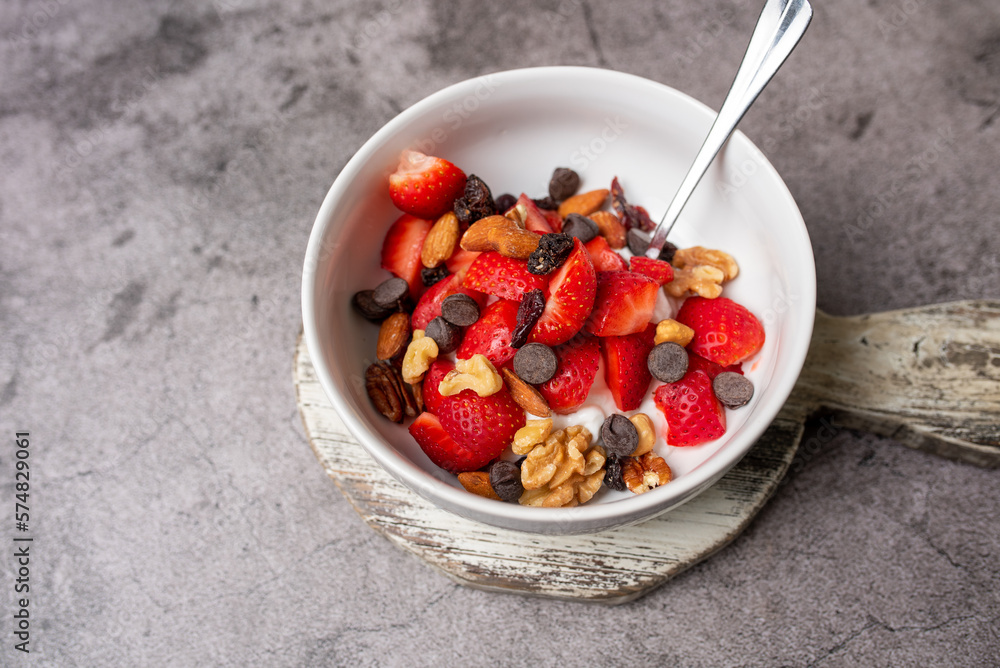 Yogurt and fruit in a bowl. Greek yogurt with fruit and nuts, healthy