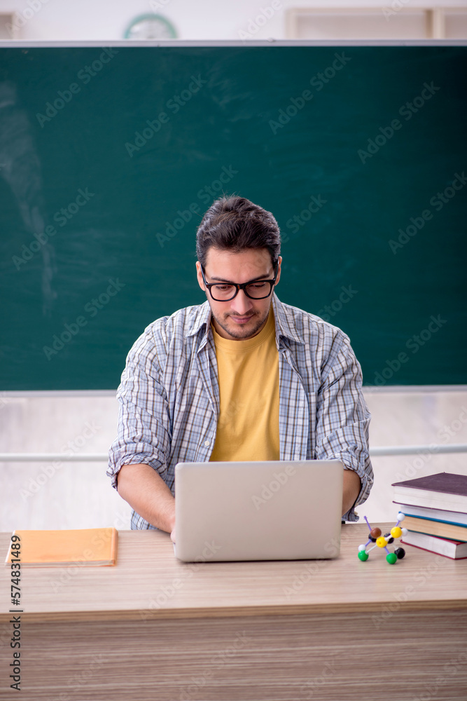 Young male student in telestudying concept Young male student in telestudying concept