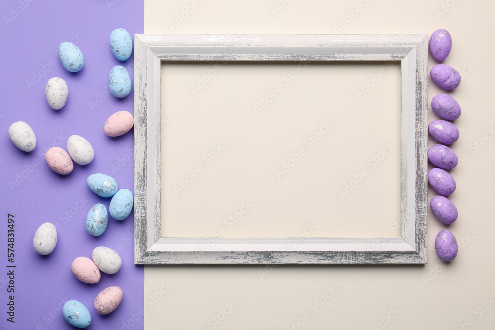 Blank wooden frame with painted Easter eggs on white and lilac background Blank wooden frame with painted Easter eggs on white and lilac background