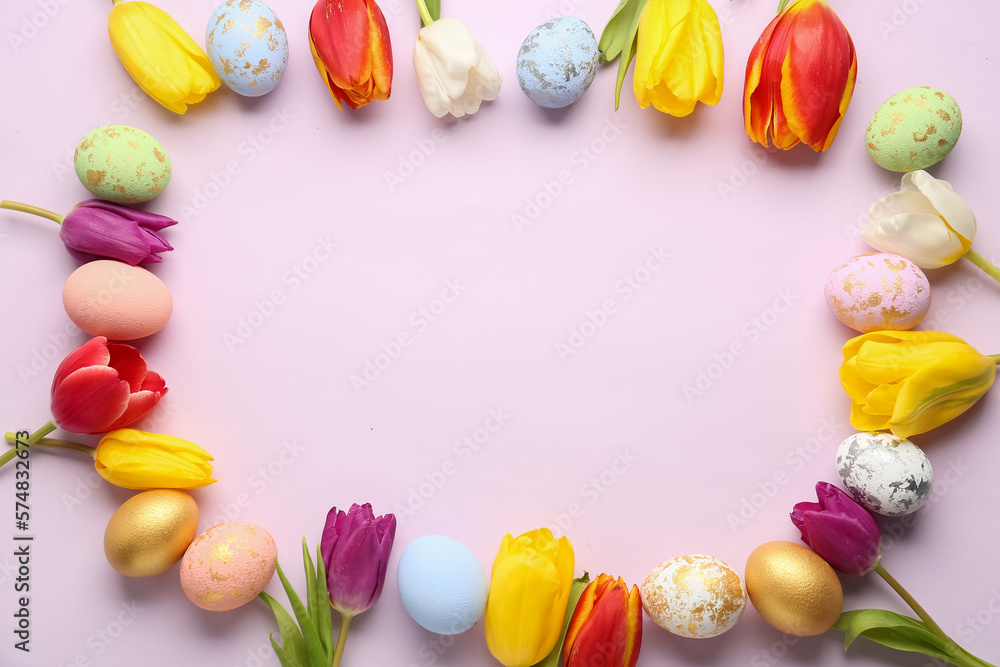 Frame made of painted Easter eggs and beautiful tulips on color background