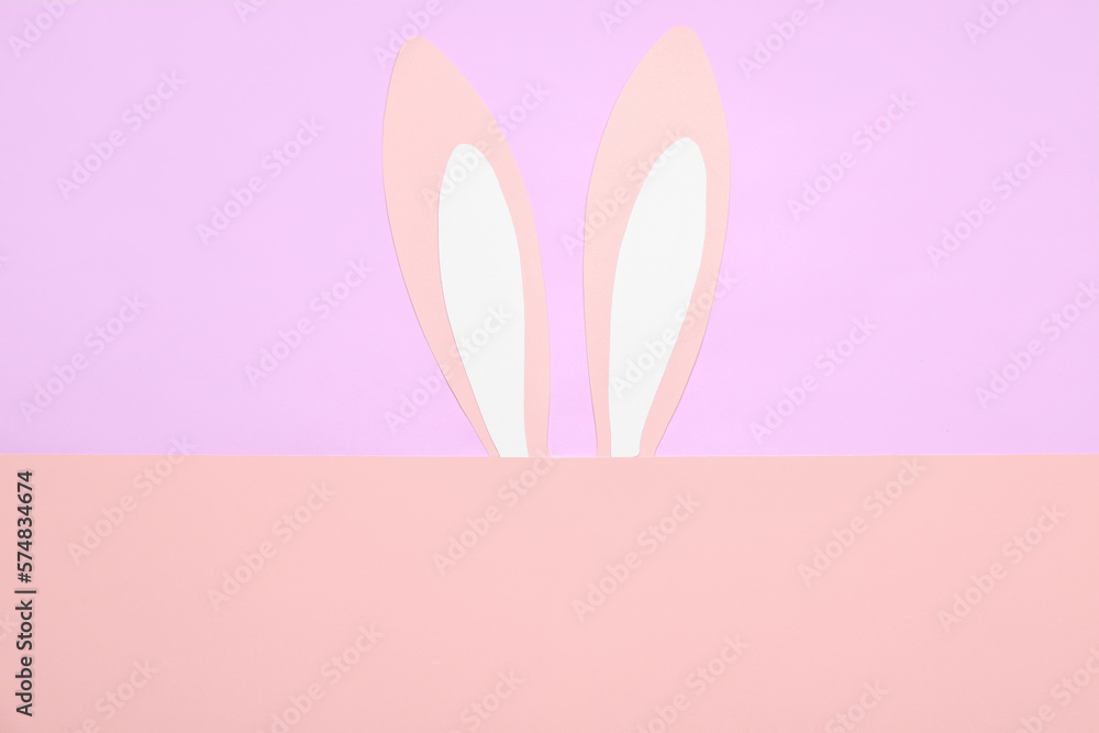 Paper rabbit ears on color background
