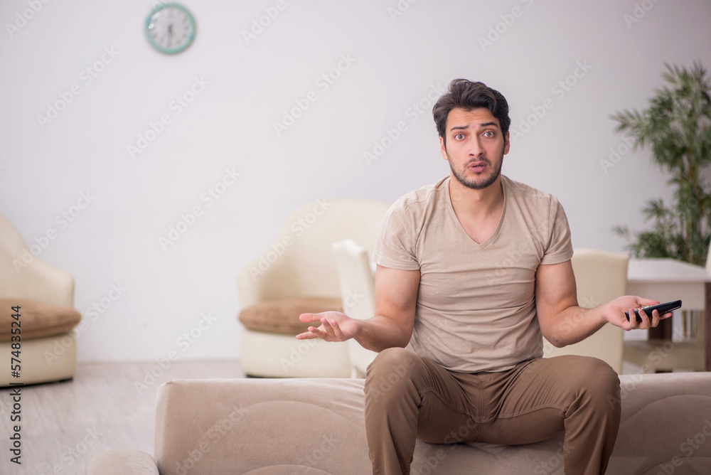 Young man speaking by phone during pandemic Young man speaking by phone during pandemic