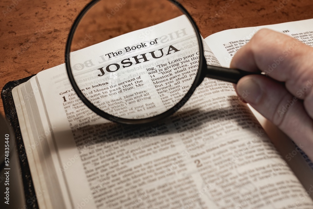 title page book of Joshua close up using magnifying glass in the bible ...