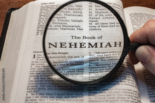 title page book of nehemiah close up using magnifying glass in the bible or Torah for faith, christian, hebrew, israelite, history, religion, christianity, Old Testament
