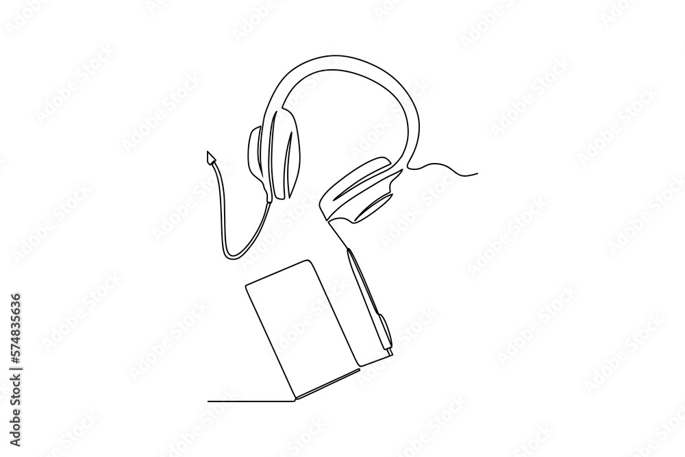 continuous line drawing of modern headphones with hardcover book on table continuous line drawing of modern headphones with hardcover book on table