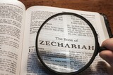 title page book of Zechariah close up using magnifying glass in the bible or Torah for faith, christian, hebrew, israelite, history, religion, christianity, Old Testament