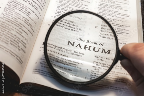 title page book of nahum close up using magnifying glass in the bible or Torah for faith, christian, hebrew, israelite, history, religion, christianity, Old Testament