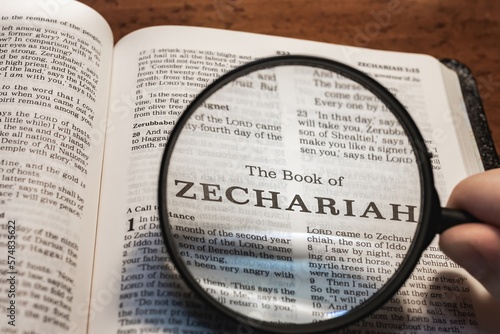 title page book of Zechariah close up using magnifying glass in the bible or Torah for faith, christian, hebrew, israelite, history, religion, christianity, Old Testament