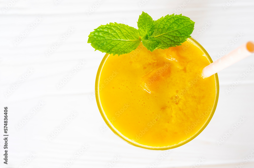 Mango smoothies yellow colorful fruit juice milkshake blend beverage healthy high protein the taste yummy In glass,drink to lose weight drink episode morning on white gray background. Mango smoothies yellow colorful fruit juice milkshake blend beverage healthy high protein the taste yummy In glass,drink to lose weight drink episode morning on white gray background.