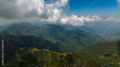 Aerial view of Fresh green foliage, tropical plants and trees covers mountains and ravine. Philippines.