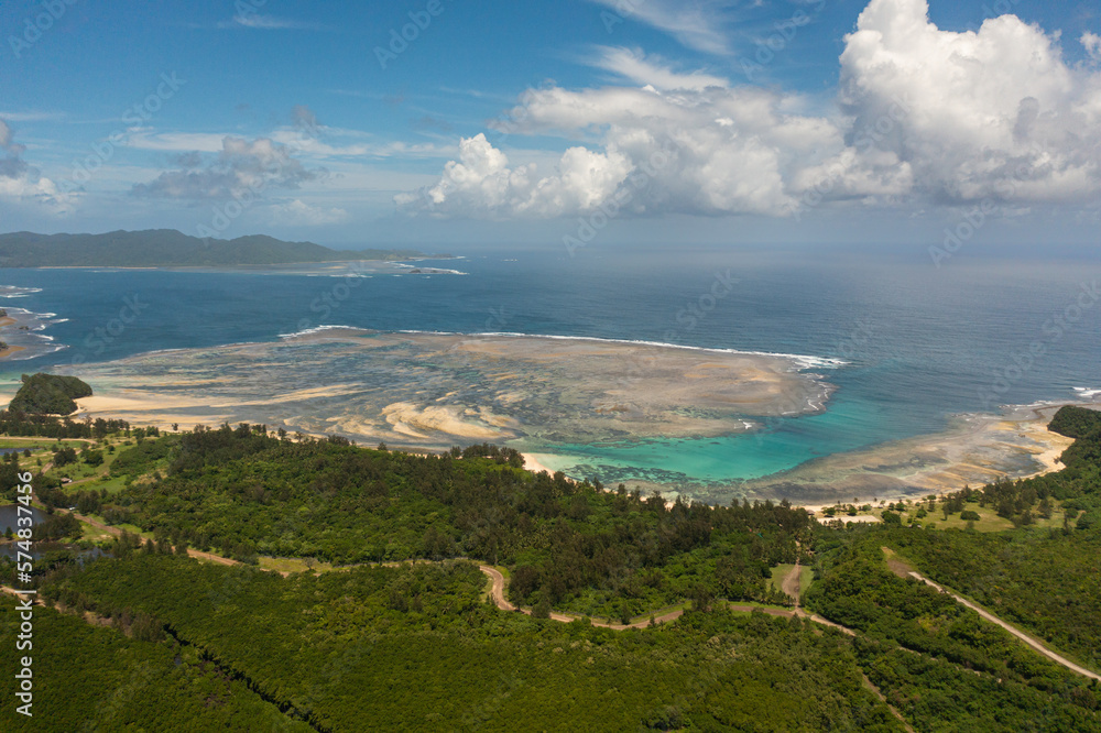 Top view of tropical island coastline and blue ocean. Luzon, Santa Ana, Cagayan. Philippines.