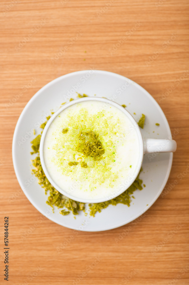 A Glass of matcha drink, served with crumble of matcha chocolate A Glass of matcha drink, served with crumble of matcha chocolate