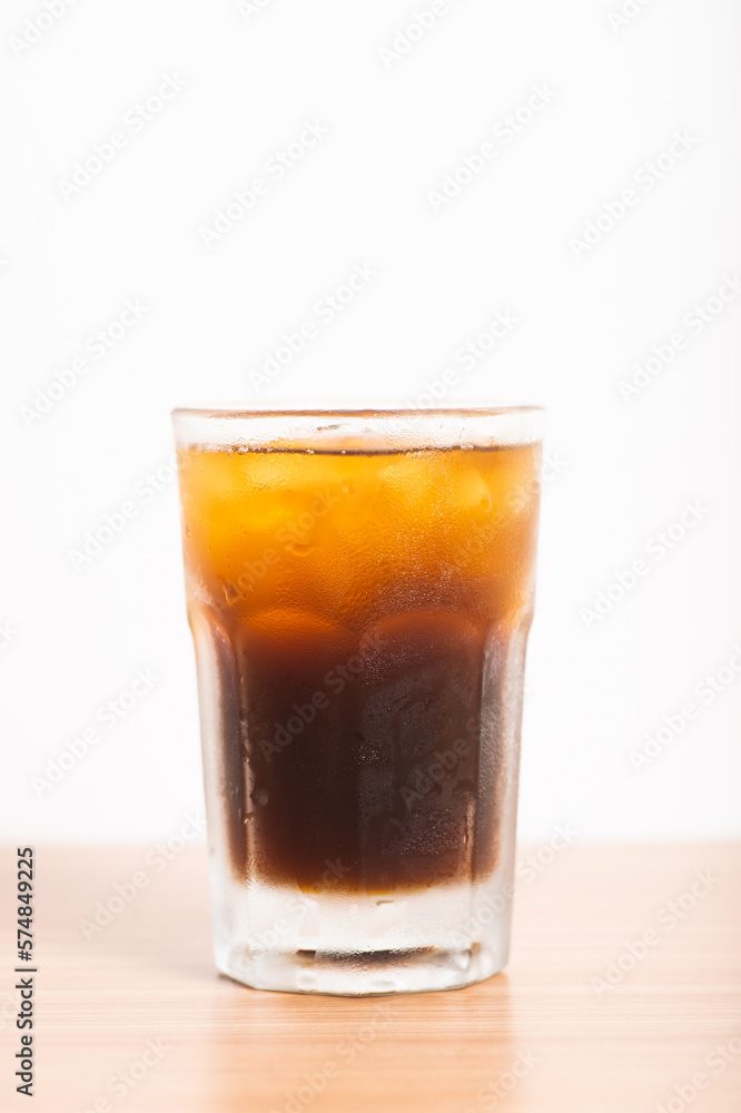 A Glass of iced americano served with ice A Glass of iced americano served with ice
