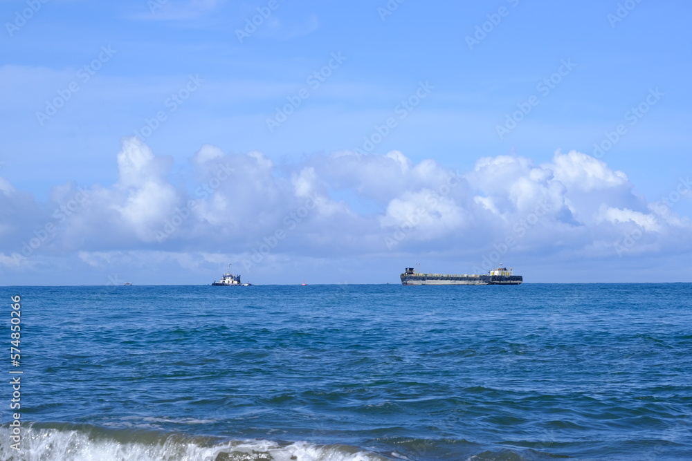 Big and small ships in the blue sea