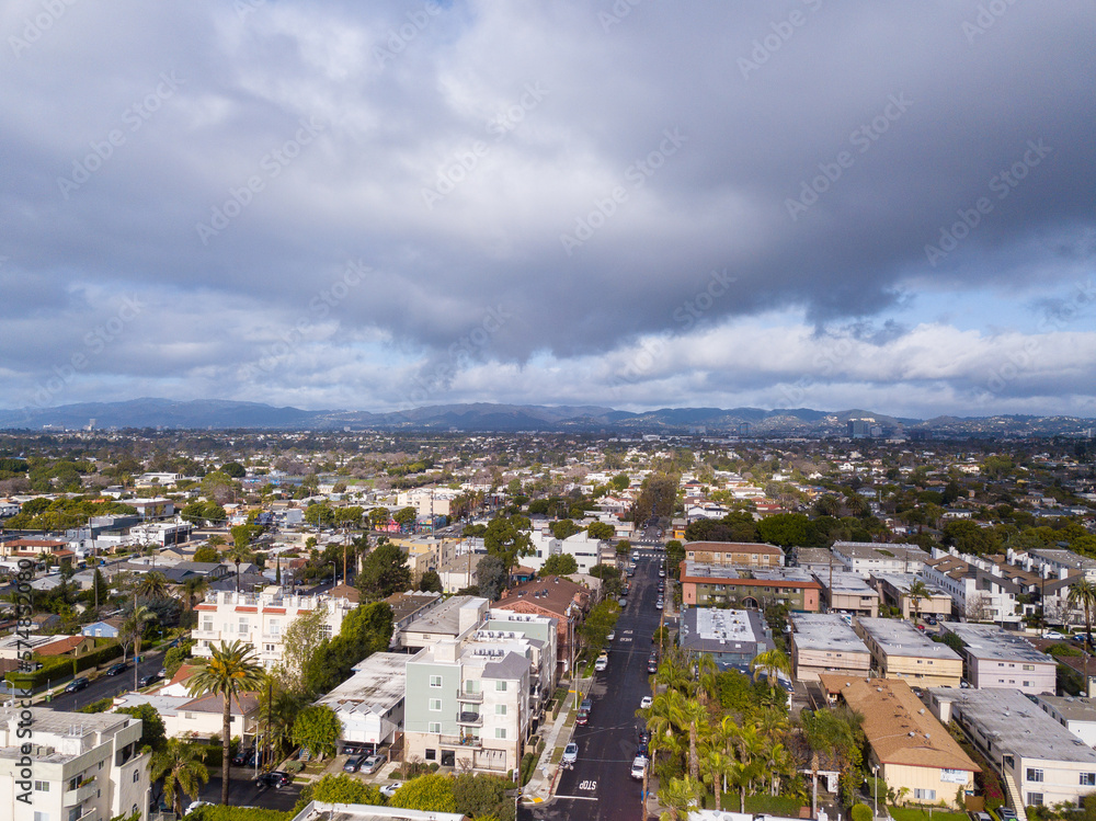 Cloudy sunset over the Los Angeles neighborhood Mar Vista. Aerial pictures taken with a drone. From this height, you can see downtown Los Angeles, mountains, and the Pacific Ocean.