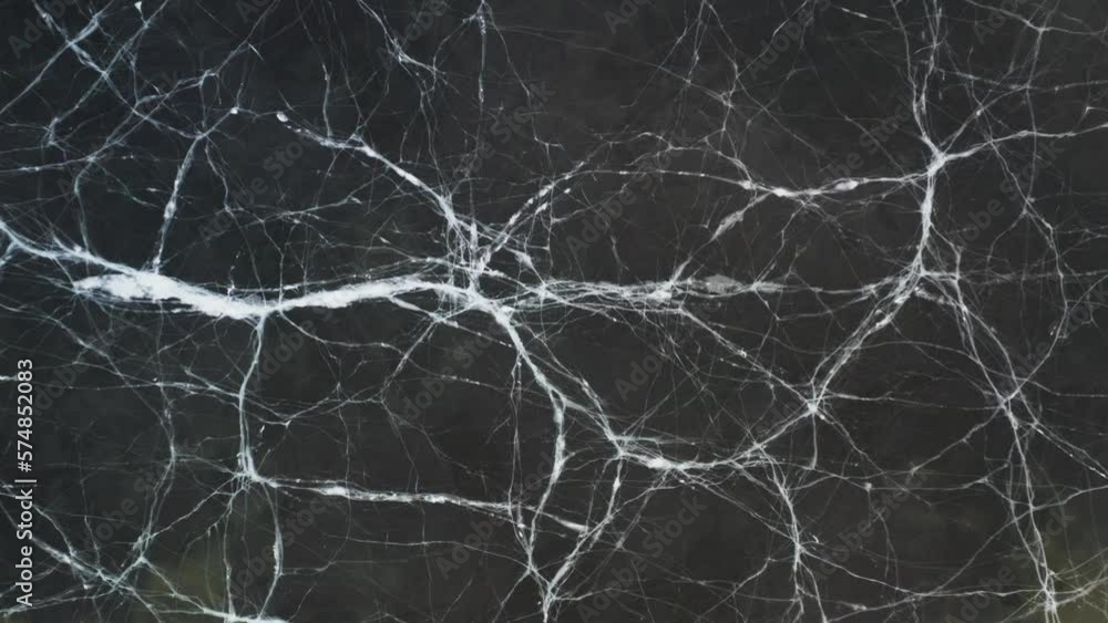 White line cracks on surface of winter frozen lake, top down White line cracks on surface of winter frozen lake, top down