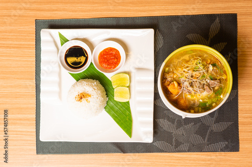 A Plate of Indonesian Dish  Served with Rice Soto Ayam
