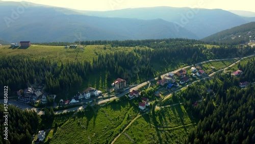 Aerial drone footage of a Romanian mountain road – Transalpina. It is a 148 km national road located in the Southern Carpathians of Romania and is one of the highest roads of the Carpathian Mountains. photo