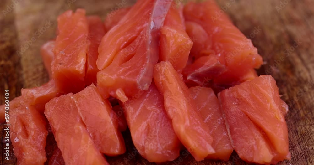 Sliced red trout meat with sea salt, medium-salted pickled red meat from trout and salmon Sliced red trout meat with sea salt, medium-salted pickled red meat from trout and salmon