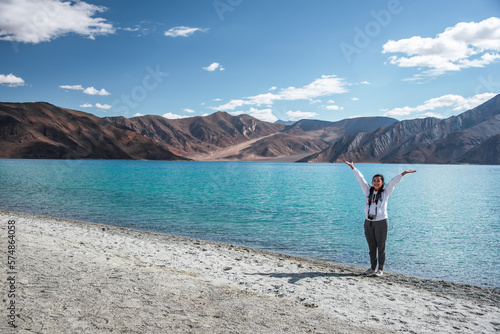 Happy girl travel Pangong lake in morning, Leh Ladakh, India