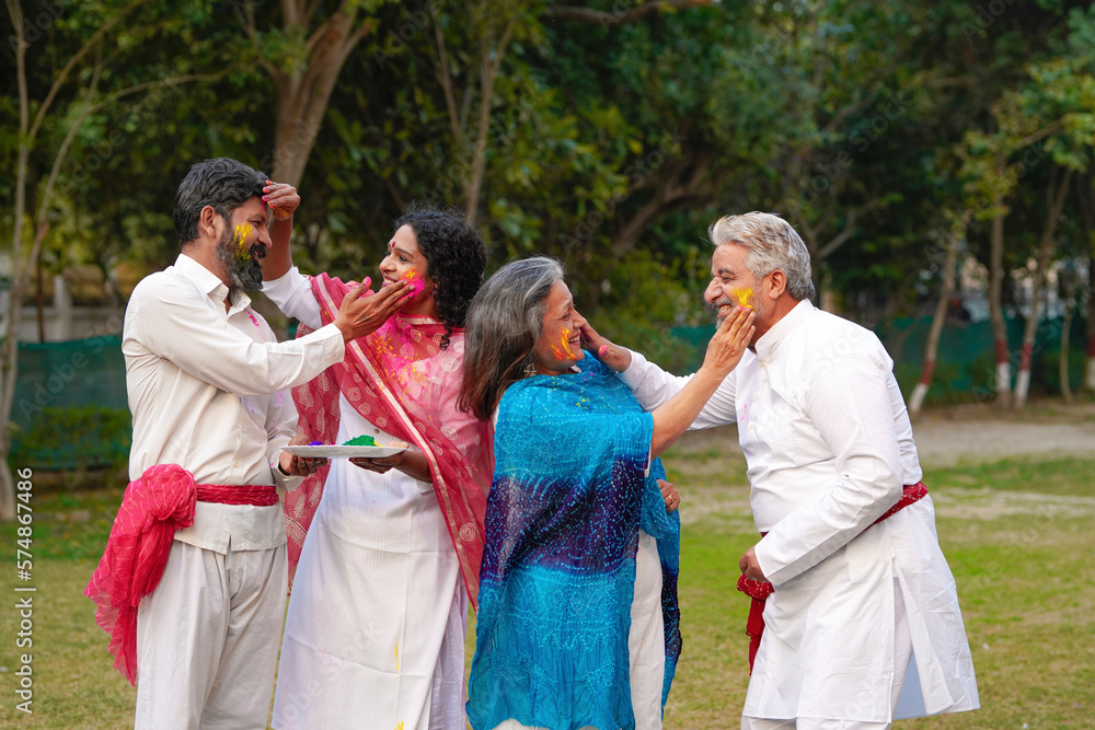 Indian people celebrate holi festival together at park. Indian people celebrate holi festival together at park.