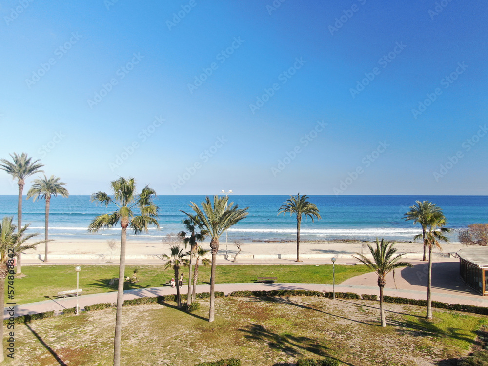 Photo of Cala Millor beach in the island of Majorca.  Summer, beach, holiday, resort and vacation scene.	