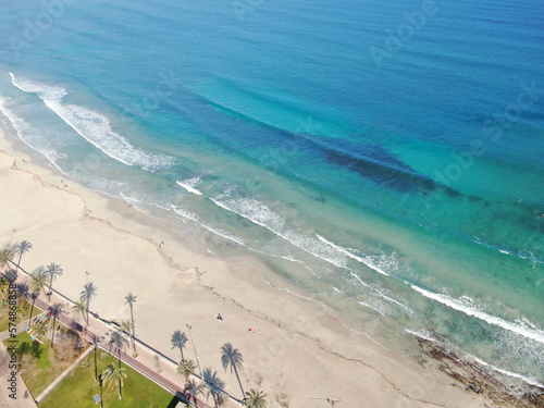 Photo of Cala Millor beach in the island of Majorca.  Summer, beach, holiday, resort and vacation scene.	