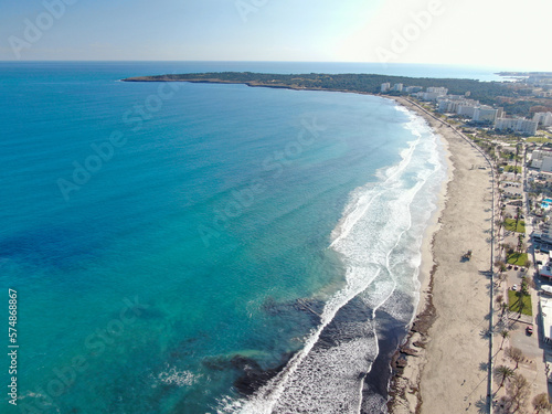 Photo of Cala Millor beach in the island of Majorca.  Summer, beach, holiday, resort and vacation scene.	