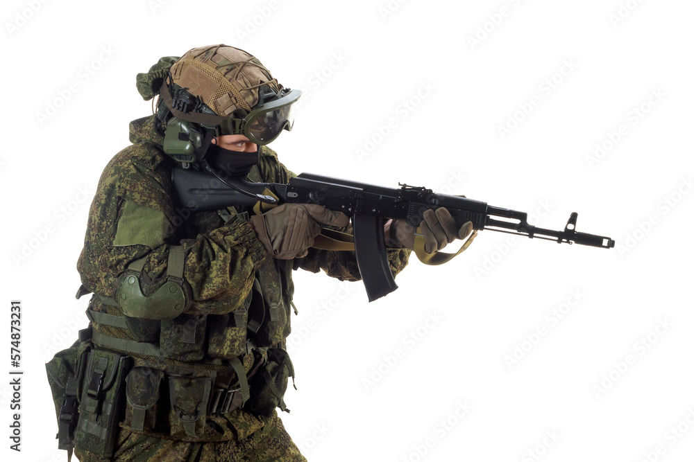 A russian mercenary soldier with AK-74 in his hand and aiming in enemy. A russian mercenary soldier with AK-74 in his hand and aiming in enemy.