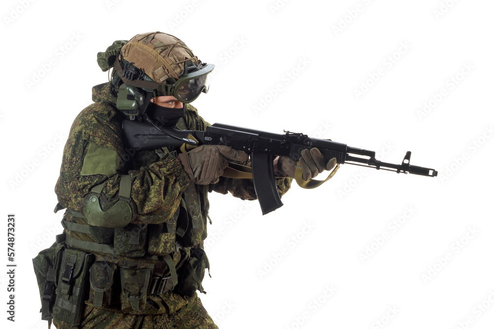 A russian mercenary soldier with AK-74 in his hand and aiming in enemy.