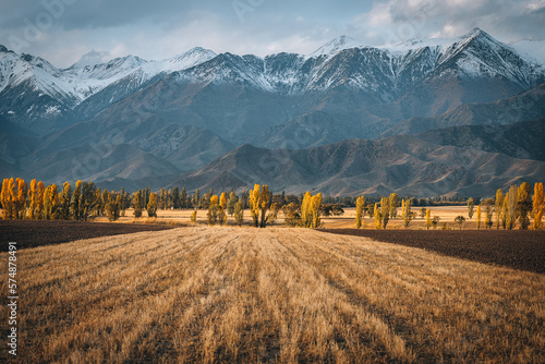 Amazing autumn landscape of Kyrgyzstan on an autumn evening near Issyk-Kul lake with a mountain view