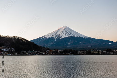 Mount Fuji on a bright winter morning, as seen from across lake Kawaguchi, and the nearby town of Kawaguchiko.