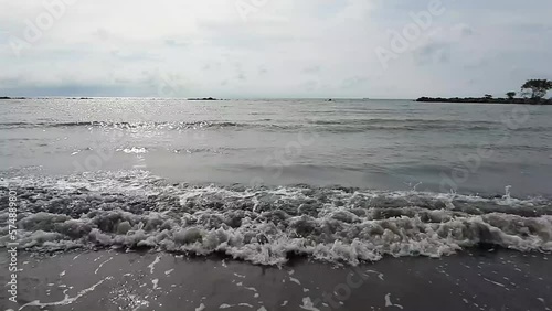 beach waves crashing in the afternoon, with the sound of waves