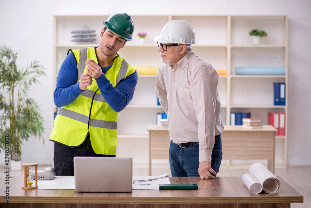 Two male architects working on the project Two male architects working on the project